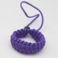 Detailed view of the purple woven paracord camera strap showing double-layer texture. - Purple