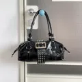 Black patent leather motorcycle shoulder bag with cool rivets and metal buckle for women. - Black