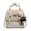 Chic women backpack stylish quilted shoulder bag with bow and cute bear pendant everyday use. - With Pendant / Off White