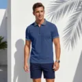 Close-up detail of men's short sleeve half-zipper polo shirt with geometric collar and cuff. - Navy Blue