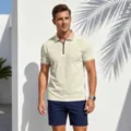 Detailed view of men's short sleeve polo shirt featuring stylish monogram collar and zip. - Off White