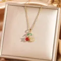 Exquisite cherry pendant necklace detail shot with sparkling cubic zirconia stones. - Cherry 2 - Gold