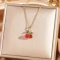Exquisite gold-plated necklace featuring a vibrant red and green crystal cherry pendant. - Cherry 3 - Gold