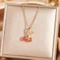 Gold cherry necklace detail shot, featuring red enamel fruit pendant on delicate chain. - Cherry 8 - Gold