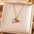 Gold cherry pendant necklace detail, elegant titanium chain with red green stones for women. - Cherry 9 - Gold