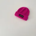 Children's pink knit beanie detail, warm winter wool hat with black patch and XXX embroidery. - 48-52cm / Rose Red