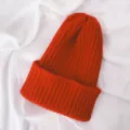 Red knitted winter beanie hat detail view, soft ribbed texture warm children's headwear - One Size / Red