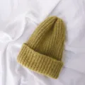 Close up view of a cozy yellow knitted beanie, soft ribbed texture for kids warm winter wear. - One Size / Yellow