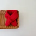 Red knitted baby scarf detail view, minimalist cross design, warm wool neck warmer kids. - Red