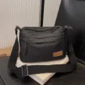 Unisex black multi-layer canvas crossbody bag, casual simple shoulder bag with large capacity. - Black