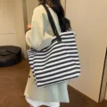 Fashionable women large capacity canvas tote bag with black white stripes for daily commuting. - Horizontal Stripes