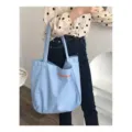 Light blue canvas tote bag with orange letters, stylish student shoulder bag for daily use. - Regular Inner Pocket / Blue