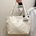 Solid color casual canvas tote bag with cute dog plush pendant for women students commuter. - White