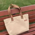 Casual beige canvas tote bag with brown straps, large capacity shoulder bag for daily commuting. - Standard Edition / Khaki