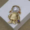 Vintage matte gold pearl little girl brooch detail, elegant rhinestone clothing accessory. - Girl Brooch