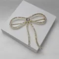 Élégante broche nœud strass doré épingle cristal accessoires de mode vêtements cadeau - Blanc