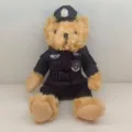 Detailed view of a cute brown teddy bear plush toy wearing a black police uniform and hat. - 25cm / Style 3