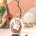 Plush hedgehog keychain detail, cute fluffy animal pendant with mini carrot charm for bag. - 13cm / Coffee