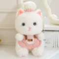 Cute white plush cat toy pendant wearing chef hat and pink striped apron, detailed view. - Chinchilla Cat