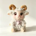 Cute fluffy sheep plush toy featuring brown horns and a sweet pink bell collar variant. - 18cm / Sitting Light Gray