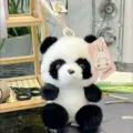 Cute panda plush toy with a hanging strap and cute rabbit tag, perfect for desk companion. - Panda