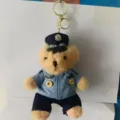 Detail shot of cute plush bear keychain wearing a police uniform and metal ring. - 15cm Pendant / Pendant 4