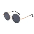 Gros plan sur des lunettes de soleil rondes en métal vintage avec verres foncés clairs. - Or Noir
