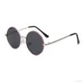 Close-up detail of round metal children sunglasses with purple rim and UV protection lenses. - Silver Pink