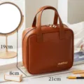 Bruine lederen cosmetische tas met handvat, grote waterdichte make-up opbergtas voor op reis. - 21*8*19cm / Bruin