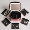 Pink metallic makeup case with LED lighted mirror and five clear storage pouches for jewelry. - 5 Sub-bags/LED Mirror Set / Rose Gold
