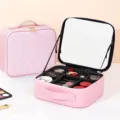 Pink quilted makeup case with adjustable dividers and mirror, ideal for travel cosmetics organization. - Diamond Lattice Pink / Full Screen Mirror