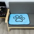 Washable coral fleece pet pee pad with cute black paw print, breathable and soft dog mat. - Blue