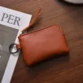 Minimalist brown leather coin purse with zipper and keyring, portable small coin pouch. - Brown