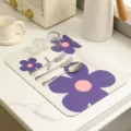 Absorbent diatomaceous earth drying mat with purple flower pattern for kitchen and coffee bar. - Sweet Time Blue