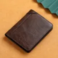 Men's bifold vertical genuine leather wallet with classic brown texture and card slots. - Coffee
