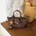 Brown Suede Handbag Casual Retro Crossbody Shoulder Bag featuring Cute Flower Pendant - With Pendant / Coffee