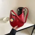 Red leather shoulder bag for women, trendy hobo saddle bag with cute strawberry charm. - With Pendant / Red