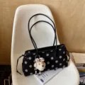 Black polka dot suede shoulder bag for women, stylish commuting handbag with cute dog charm. - With Charm / Black