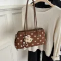 Brown suede shoulder bag with large polka dots and cute plush bear keychain for women commuting. - With Charm / Mocha Brown