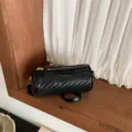 Retro textured black woven cylindrical shoulder crossbody bag for women, stylish pillow bag. - Black