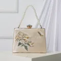 Elegant champagne satin evening clutch bag featuring floral embroidery pearl handle. - Champagne