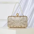Elegant gold rhinestone evening clutch bag with pearl handle and sparkling floral design. - Gold