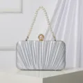 Elegant silver pleated evening clutch bag with pearl handle and stylish clasp for women. - Silver