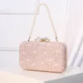 Elegant pink lace evening clutch bag with pearl handle and sparkling rhinestone bow clasp. - Pink