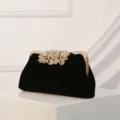 Black velvet evening clutch bag with gold frame and stunning rhinestone leaf clasp for women. - Black