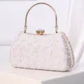 Elegant silver evening clutch bag with metal round handle and sparkling crystal clasp for women. - Silver
