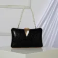 Elegant black evening clutch bag featuring a stunning pearl handle and gold leaf clasp variant. - Black