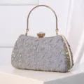 Elegant metallic handle evening clutch bag with crystal clasp and textured fabric finish. - Gray