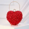 Red heart-shaped beaded evening clutch bag with metal handle and shiny sequin design. - Red