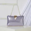 Elegant purple metallic evening clutch bag featuring a pearl handle and gold leaf clasp. - Light Purple